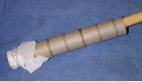 Image of cardboard tube with covered end and broomstick inserted as described in experiment