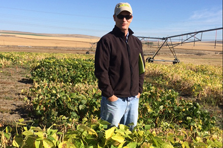 Phil Miklas standing in a field.