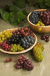 Display of green, red, purple and black grapes. Link to photo information
