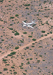 Photo: ARS pilot Michael Ren• Davis flies the Cessna over the Jornada Range. Link to photo information