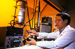 Chemical engineer Peter Wan takes a sample