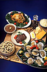 Food display that includes chicken, eggs, cheese, oysters, beef, beans and peanuts. Link to photo information