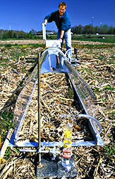 Soil scientist Rodney Thompson prepares to measure ammonia loss from liquid manure.