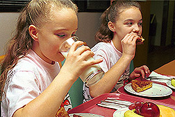 Photo: Two girls eating healthy food. Link to photo information