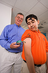 Photo: A tricep skinfold test is being used to measure the fat level of a middle school student. Link to photo information