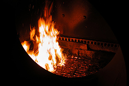 Photo: A boiler furnace with a fire fueled by biomass pellets. Link to photo information