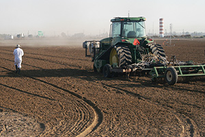 A tractor injects fumigants 46 centimeters deep into the soil