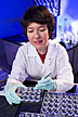 Biochemist prepares tissue samples.