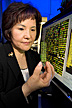 Immunologist holding a gene chip containing up to 10,000 chicken genes.