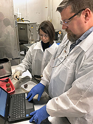 ARS food technologist Anna C. S. Porto-Fett and microbiologist John B. Luchansky measure the temperature of meatballs. Link to photo information
