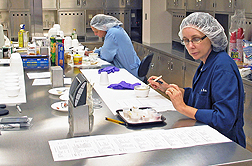 ARS food technologists preform a sensory panel taste test fo catfish samples