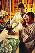 Entomologist and technician examining insect cell cultures.