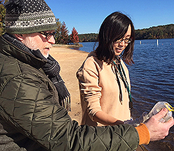Researchers collect a water sample from the Upper Oconee watershed