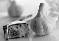 Photo: Garlic and garlic press.