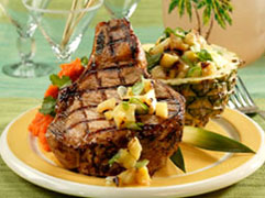 Grilled pork chop with tropical fruit salsa.
