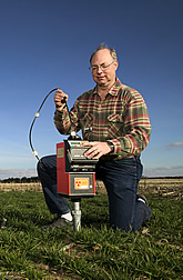 David Nielsen operates neutron probe to measure soil moisture. Link to photo information