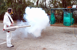 Person demonstrates use of thermal fogger.