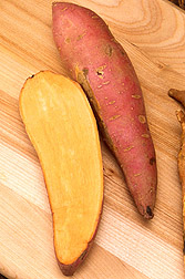 Photo: Halved and whole sweetpotatoes. Link to photo information