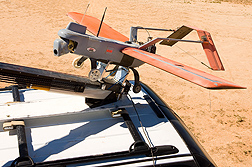 Photo: An unmanned aerial vehicle being readied to launch from a catapult to survey rangeland. Link to photo information