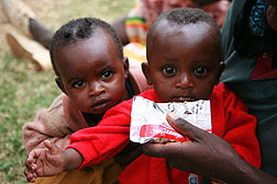 Photo: Two malnourished children receiving food assistance in Ethiopia.