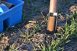 Surface soil is sampled in a field in Virginia 