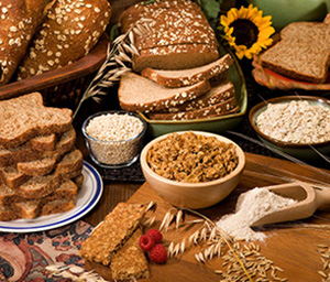 Whole grain bake goods including breads, oat flakes, hot and cold cereals, and oat flour.