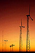 wind turbines before the horizon at sunset